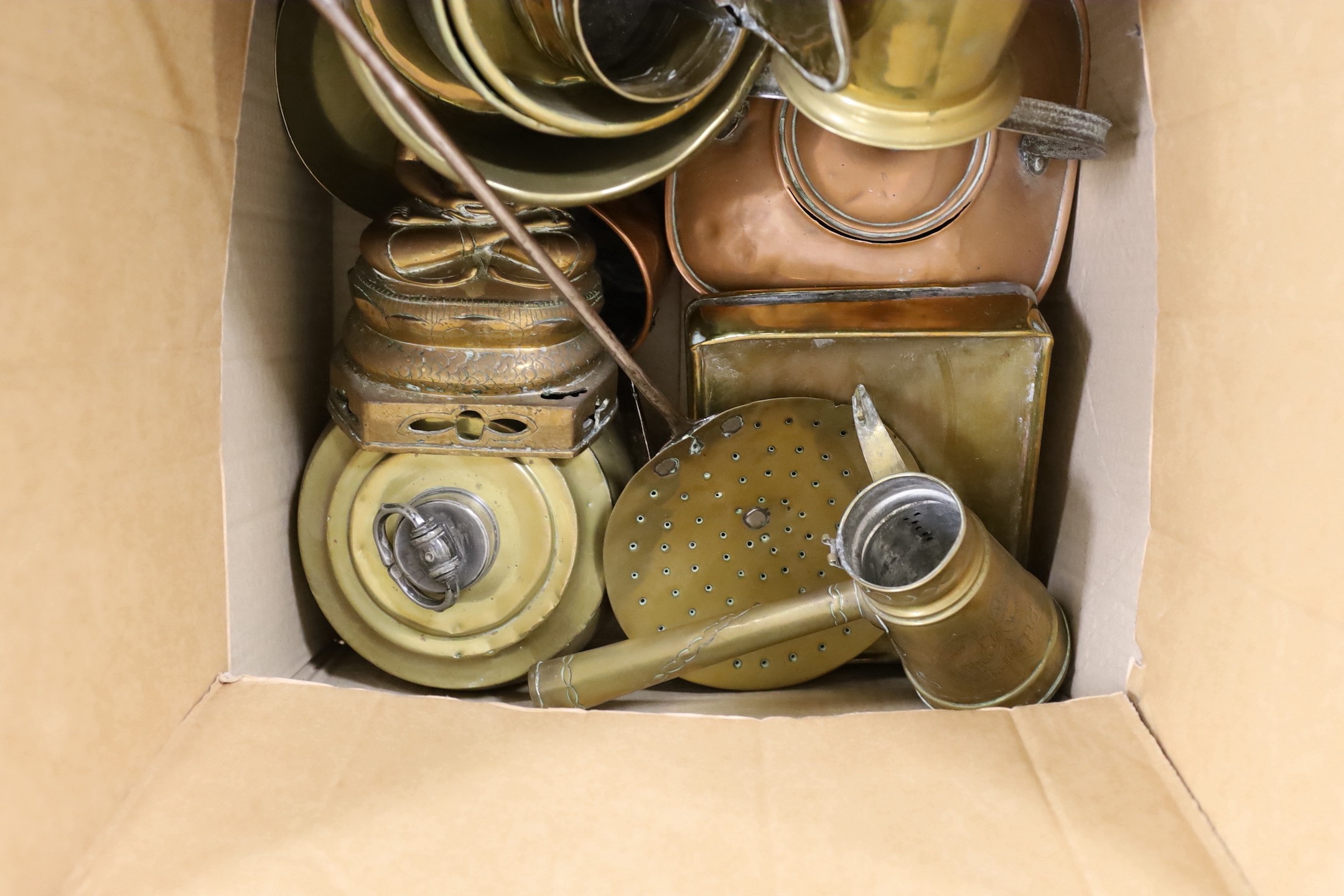 A collection of Middle Eastern copper and brassware, including two large Arabic Dallah